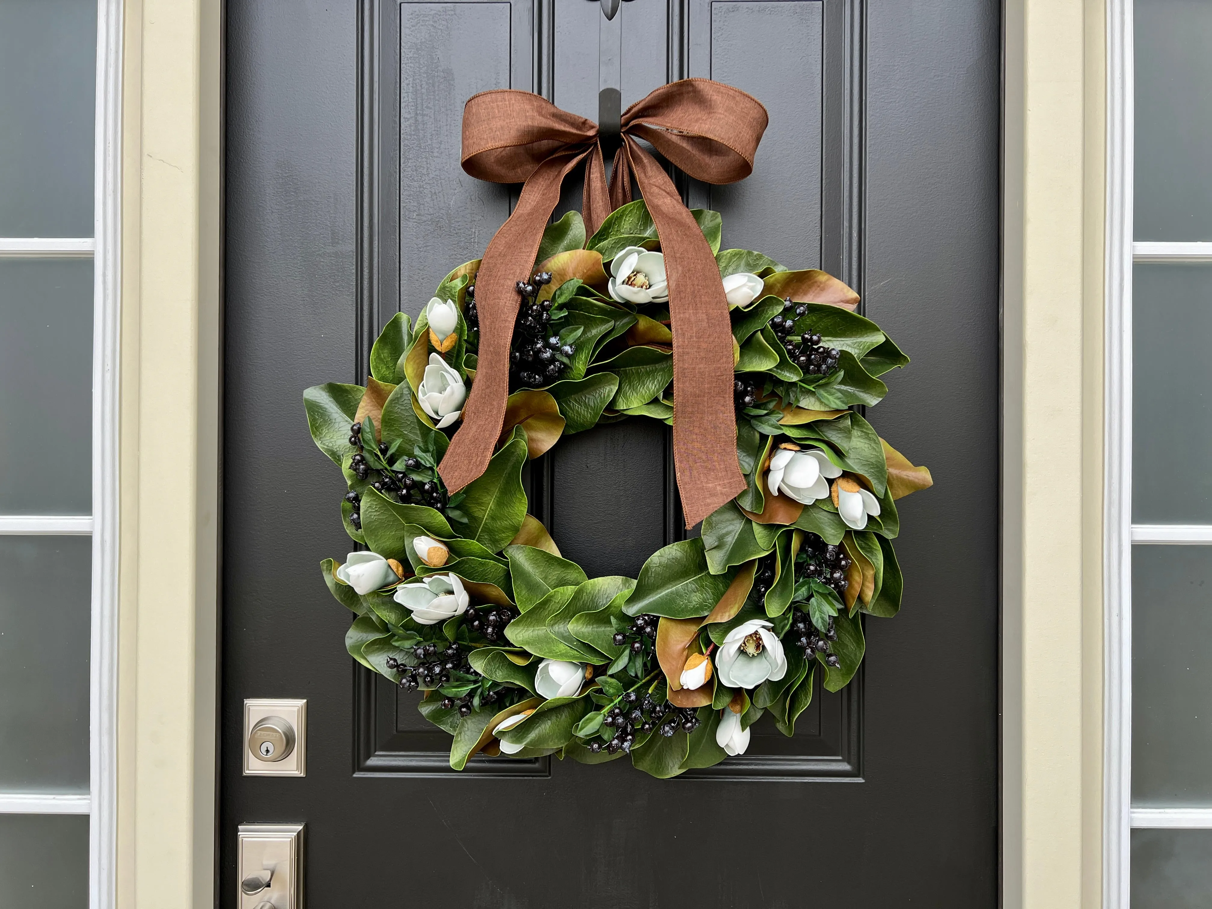 Blue Magnolia Wreath with Blue Berries and Brown Linen Ribbon