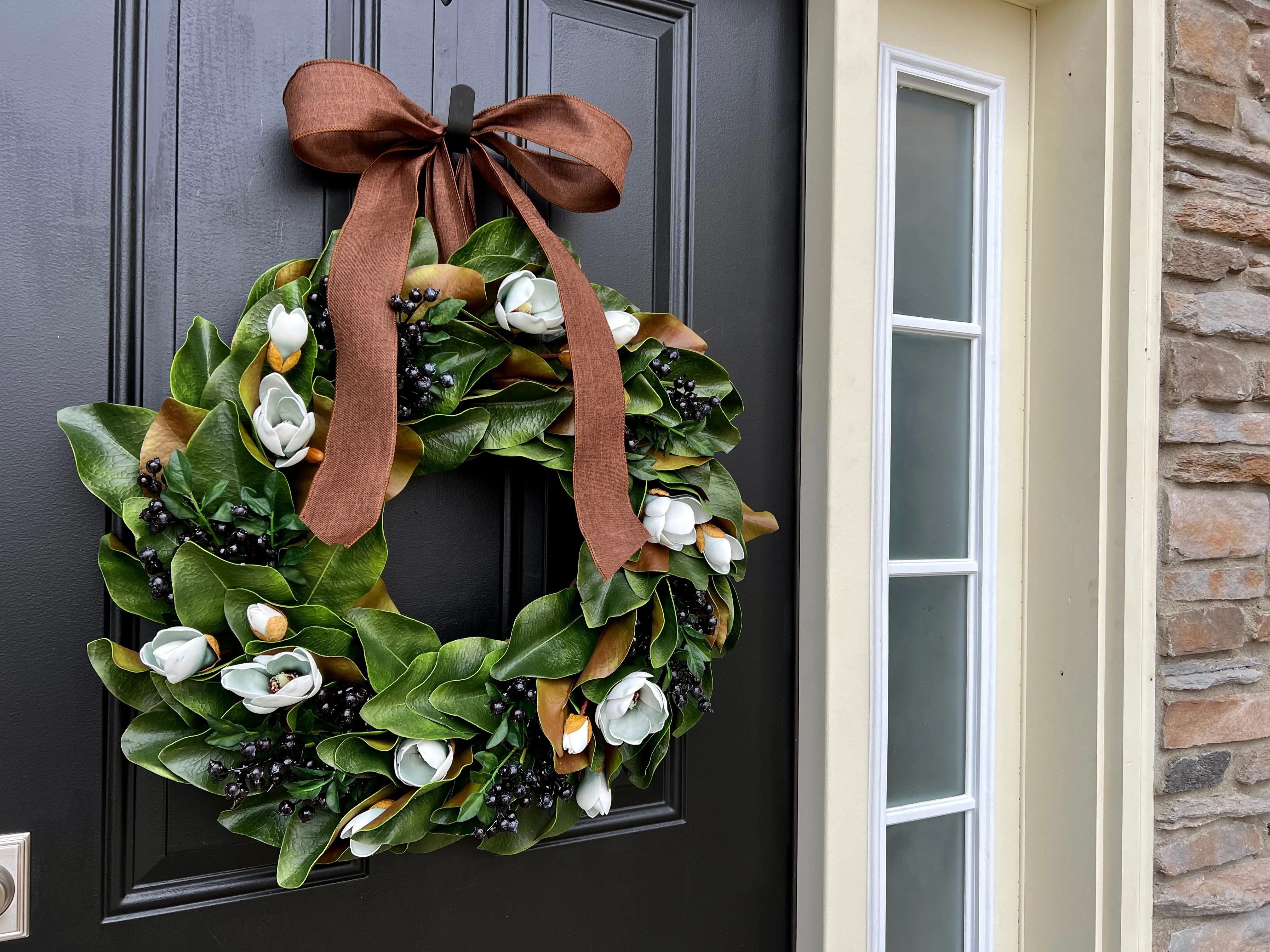 Blue Magnolia Wreath with Blue Berries and Brown Linen Ribbon