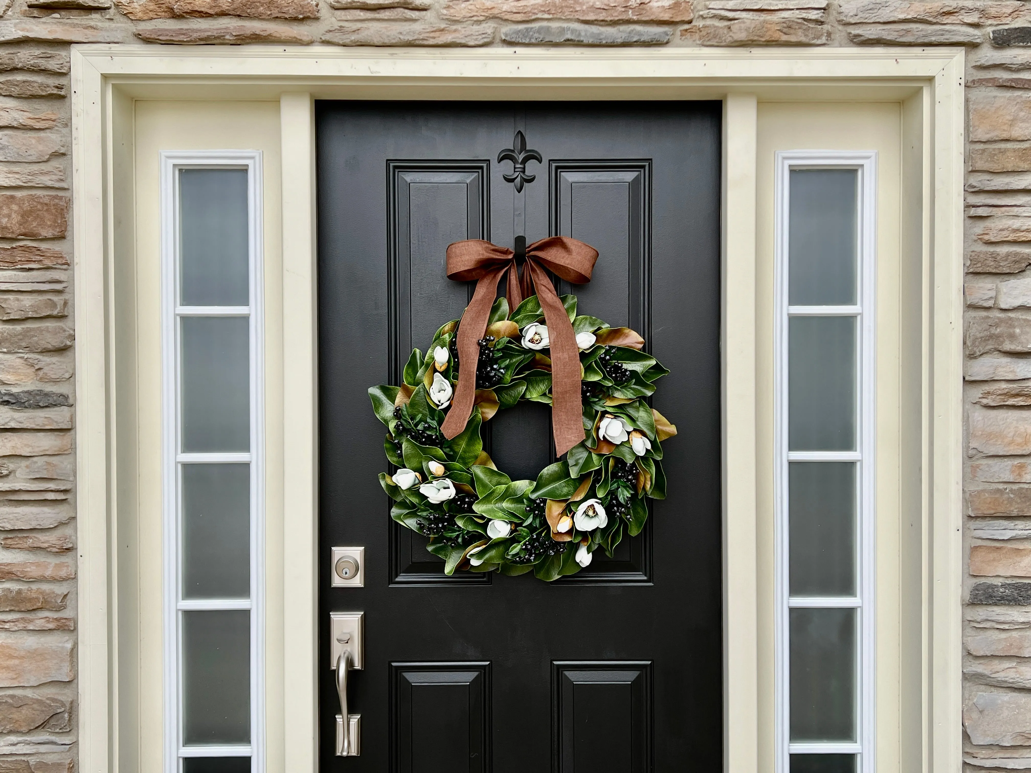 Blue Magnolia Wreath with Blue Berries and Brown Linen Ribbon