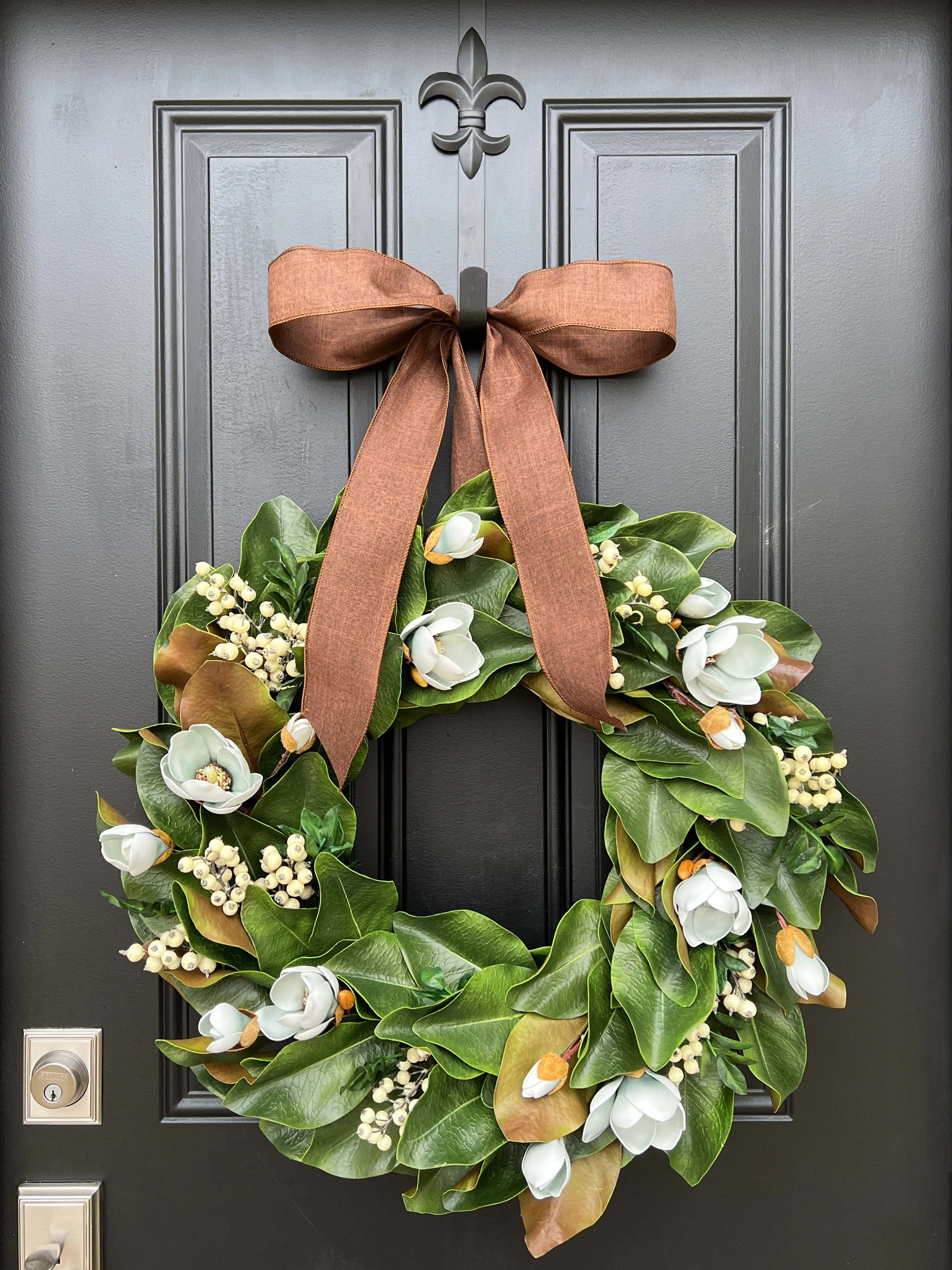 Blue Magnolia Wreath with Blue Berries and Brown Linen Ribbon