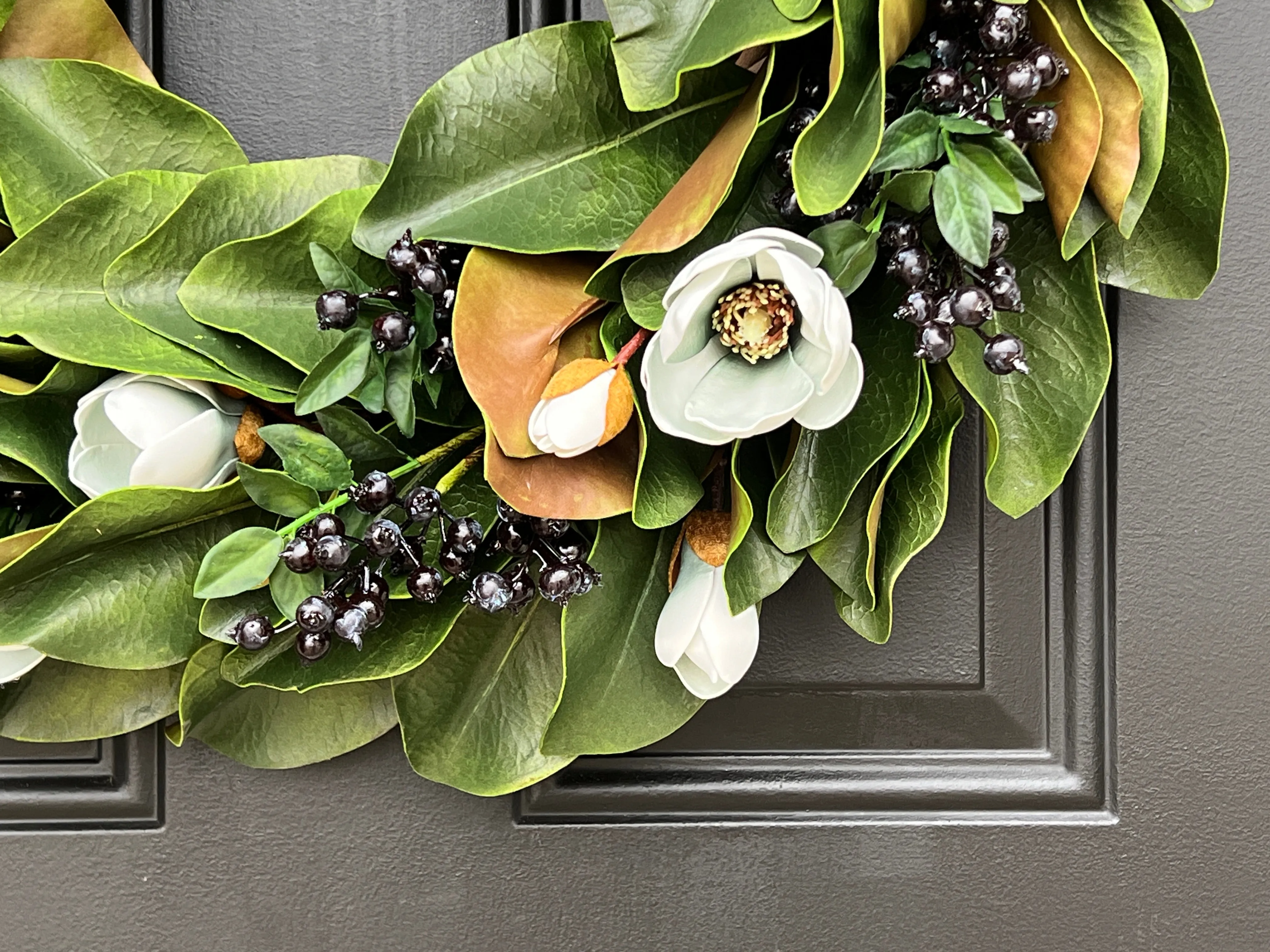 Blue Magnolia Wreath with Blue Berries and Brown Linen Ribbon